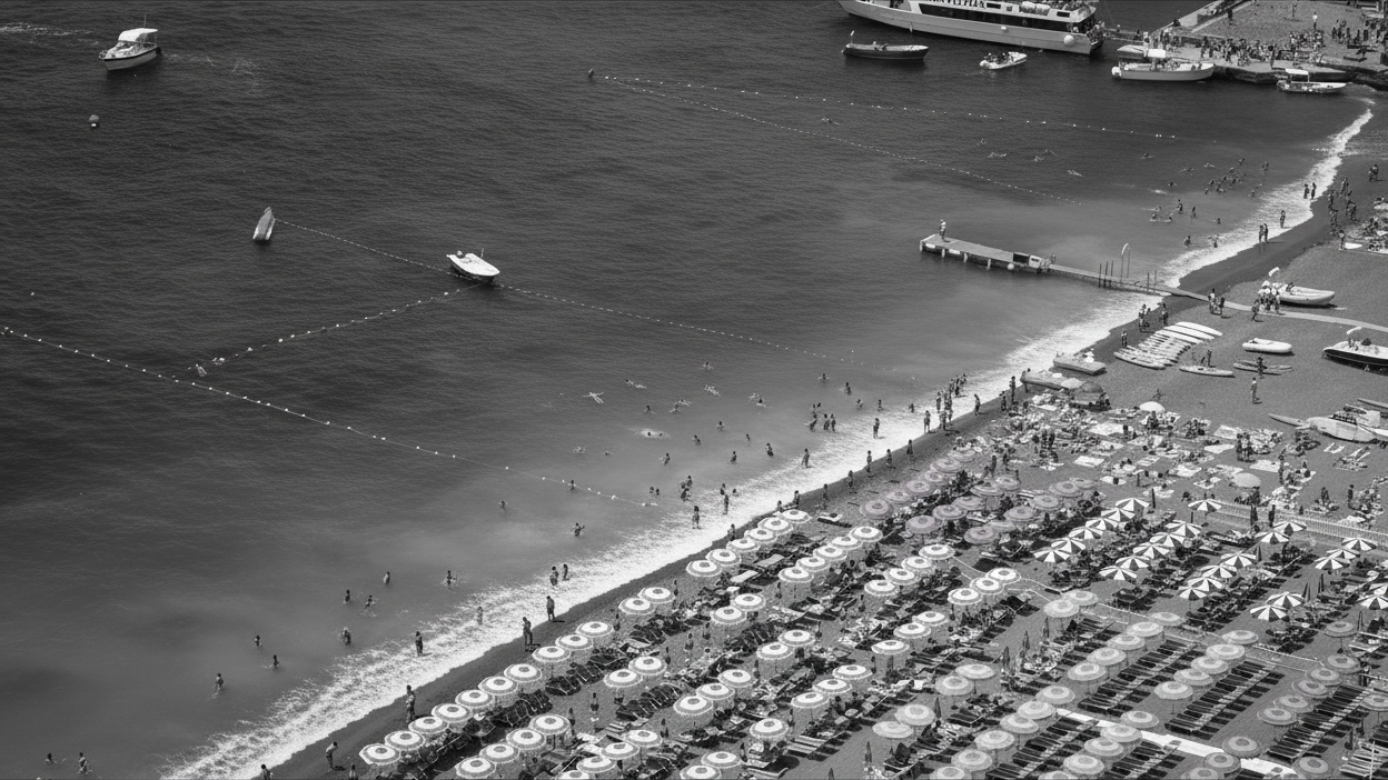 Two women sitting at a modern table talking with a city view behind them.